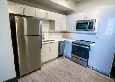 Kitchen with Stainless Steel Energy Star Appliances at Merchants Plaza Apartments