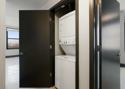 Stacked, In-closet Washer and Dryer in a Merchant's Plaza Apartment